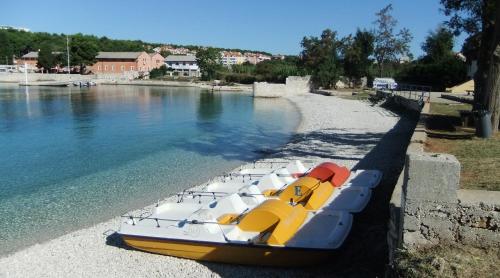a boat parked on the shore of a river at HI Hostel Pula in Pula
