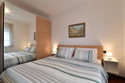 Postel nebo postele na pokoji v ubytování City penthouse Vita