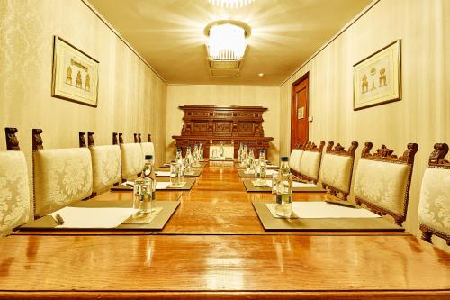 a large conference room with a long table and chairs at Grand Hotel Continental Bucuresti in Bucharest