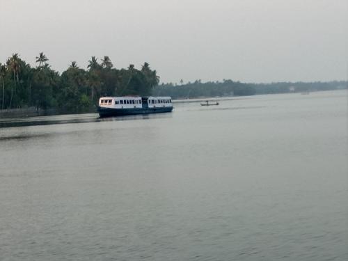 a boat in the middle of the water at Agape Marari in Mararikulam