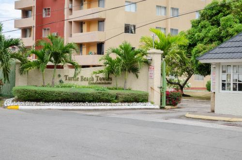 a building with a sign that reads little baby island at Malia Dreamers Paradise in Ocho Rios