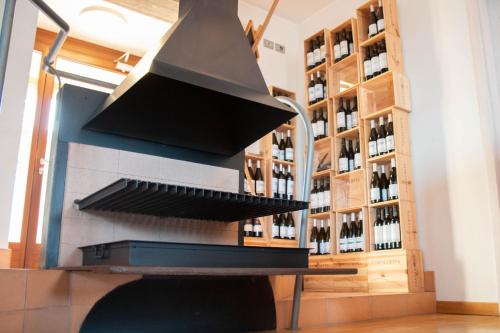 a wine tasting room with a rack of wine bottles at Locanda Fontezoppa in Civitanova Alta