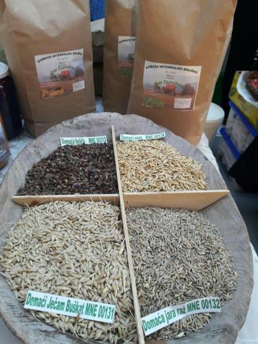 a bunch of different types of rice on a table at Organic Family Farm in Žabljak