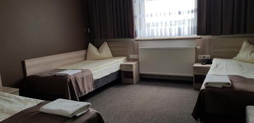 Postel nebo postele na pokoji v ubytování Zajazd Tytan