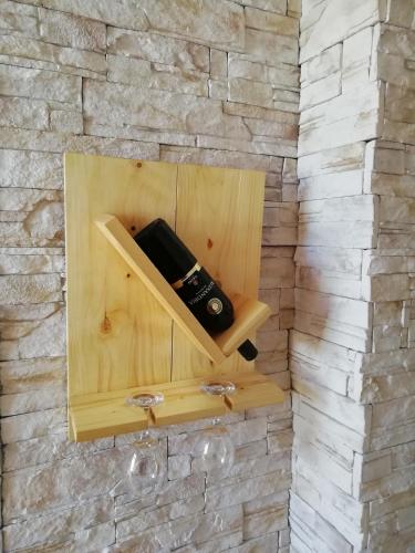 a wall with a wooden box on a stone wall at Two Kings apartment in Novi Sad