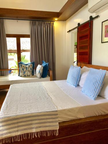 Katil atau katil-katil dalam bilik di The Village Siargao