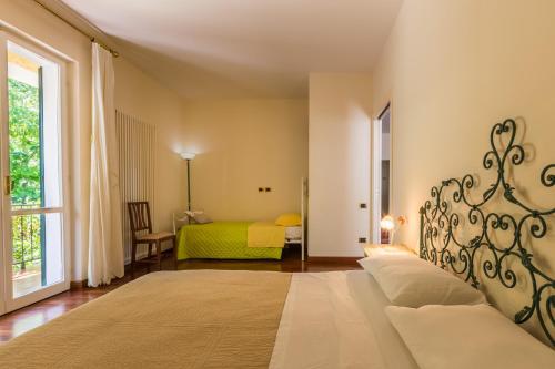 En eller flere senger på et rom på Villa La Quiete