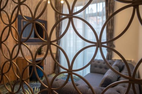 a close up of a metal fence with a window at ART Hotel in Sibiu
