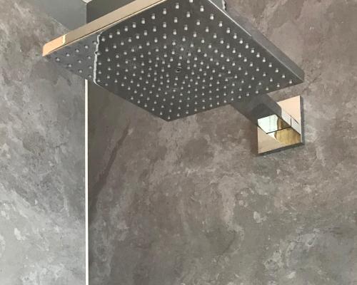 a black and white ceiling light on a concrete wall at Goodnight Leuven - Self check-in with airco in Leuven
