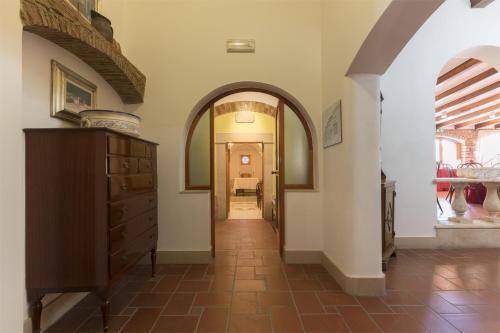a hallway with an archway leading into a room at Masseria Sant'Anna in Bari