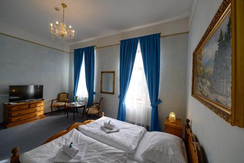 Кровать или кровати в номере Hotel Na Zámečku