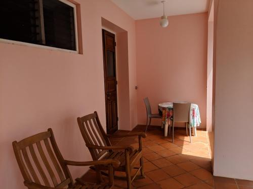 a dining room with a table and chairs at La Sagesse Hotel, Restaurant and Beach Bar in Content