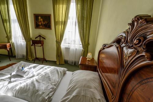 Una cama o camas en una habitación de Hotel Na Zámečku