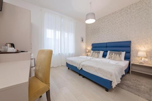 מיטה או מיטות בחדר ב-S. Martino Rooms