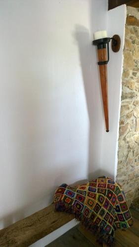 a corner of a room with a pillow and a wall at Gite Rouge and la Ferme Blanche in MÃ©nil-Vin