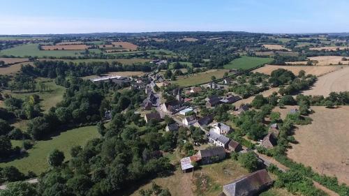 an aerial view of a small village in a field at Gite Rouge and la Ferme Blanche in MÃ©nil-Vin