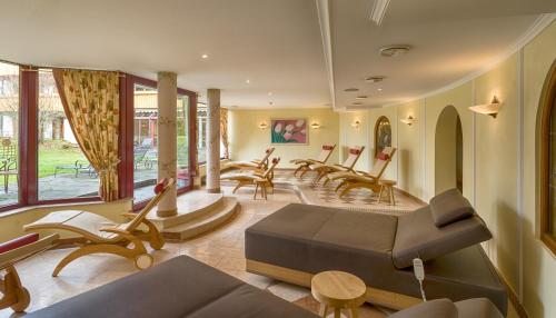 a living room with a lot of chairs and a couch at Hotel Thomahof in Hinterzarten