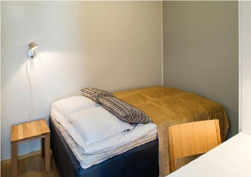 Tempat tidur dalam kamar di Cozy Central Studio Tampere