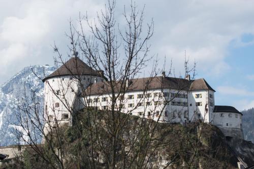 a castle on the side of a mountain at Your Home - City Apartment in Kufstein in Kufstein