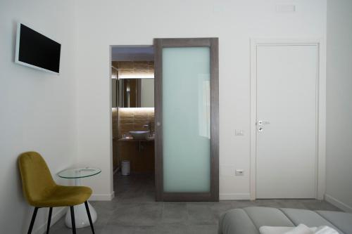 a living room with a couch and a chair and a table at LECENTRE 174 in Salerno