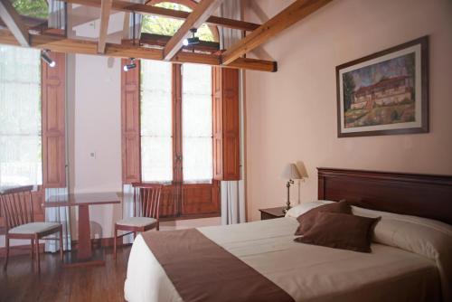 En eller flere senger på et rom på Posada del Frayle Bentos