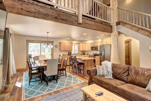 a living room and kitchen with a couch and a table at North Forty Resort in Columbia Falls