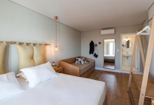 Ένα ή περισσότερα κρεβάτια σε δωμάτιο στο The Rex Hotel Porto