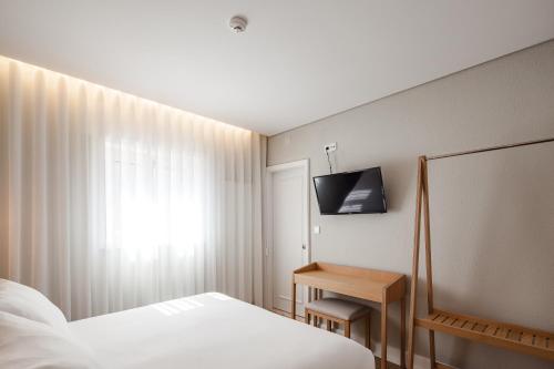 Μια τηλεόραση ή/και κέντρο ψυχαγωγίας στο The Rex Hotel Porto