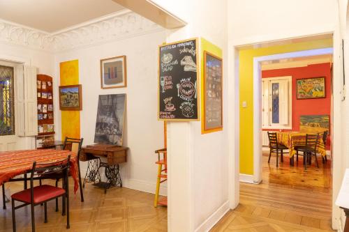 a room with a table and a dining room at Hostal Rio Amazonas in Santiago