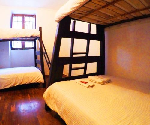 Postel nebo postele na pokoji v ubytování Arche Noah Boutique Hostel