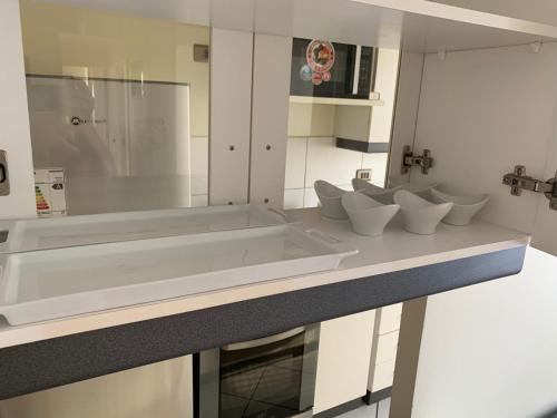 a bathroom with four toilets on a counter at Departamento Libertad Chillan - Central - Factura - Empresas - Parking - Wifi in Chillán