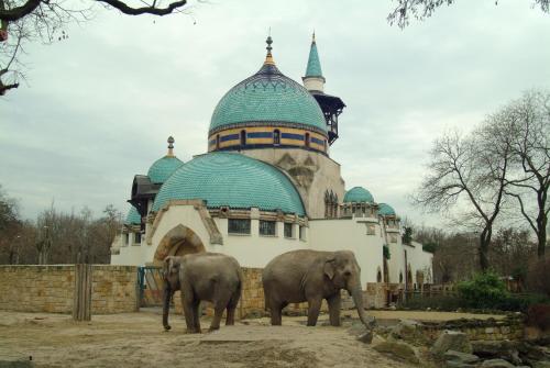 two elephants standing in front of a building at Benczur Hotel in Budapest