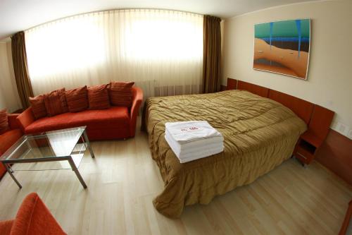 Giường trong phòng chung tại Vila Tekila