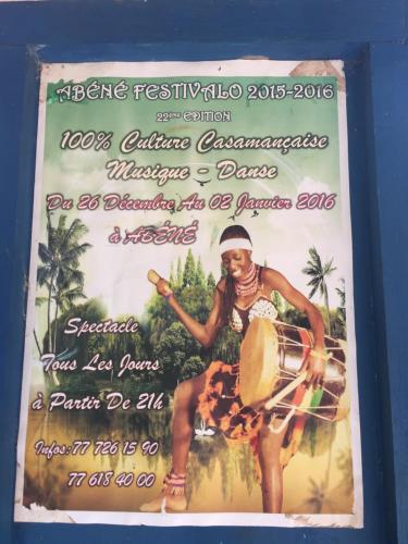 a poster for a festival with a woman playing a instrument at Chez Bethy Jungle et Océan in Abene