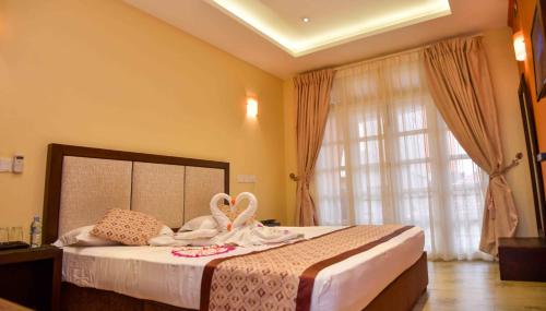 Кровать или кровати в номере Ceylon Sea Hotel