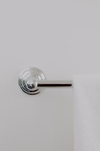a chrome door handle on a white door at The Bayview Motel - Fort Frances, ON - Lakeside Motel in Fort Frances