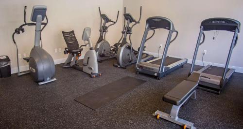 a bunch of exercise bikes in a gym at The Rushmore Hotel & Suites; BW Premier Collection in Rapid City