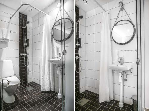 a bathroom with a toilet and a sink and a mirror at Best Western Hotel Savoy in Karlstad
