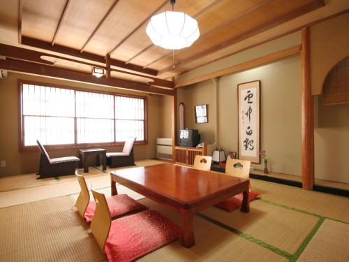a living room with a table and chairs at Hotel Sunvalley Nasu in Nasu