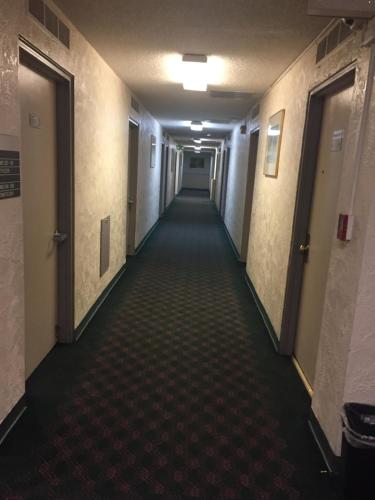 a hallway of an office building with a long corridor at Motel express in Everett