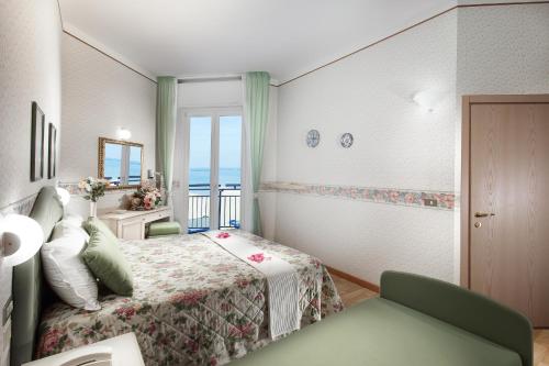 Postel nebo postele na pokoji v ubytování Hotel Sporting