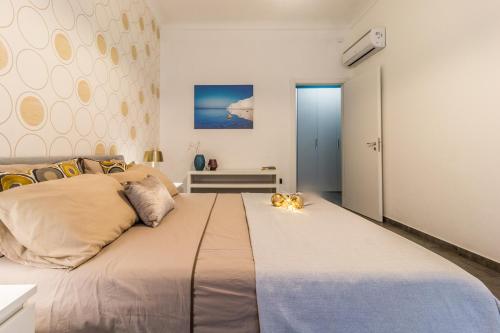 Кровать или кровати в номере Sirhouse - Boutique Apartment in Ortigia