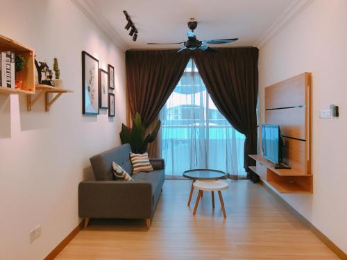 a living room with a couch and a table at Mykey The Wave B-21-15 Melaka City in Melaka