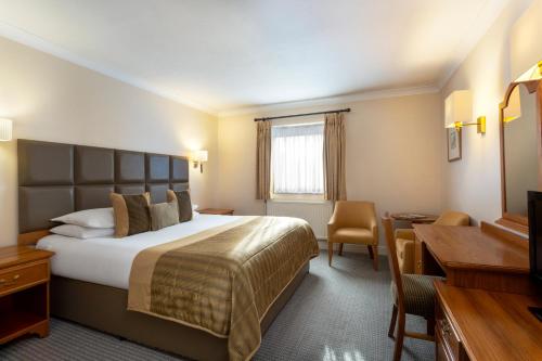 Katil atau katil-katil dalam bilik di Bridgewood Manor Hotel & Spa