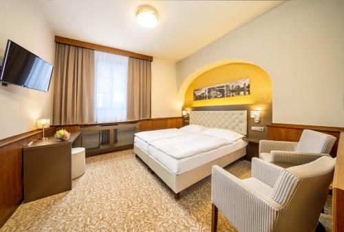 Hotel Zlatá hvězdaにあるベッド