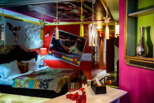 a bedroom with a bed and a table and a mirror at Diplomat Plaza Hotel & Resort in Lukovit