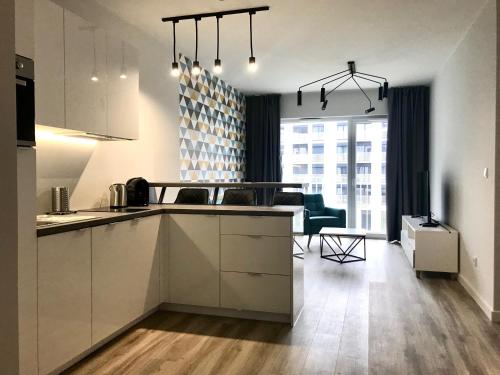 Kuchyňa alebo kuchynka v ubytovaní Apartamenty Zajezdnia MTP