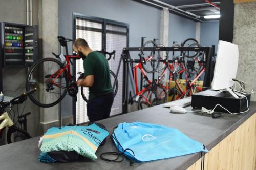 a man is working on a bike in a garage at Bordoy Cosmopolitan in Playa de Palma