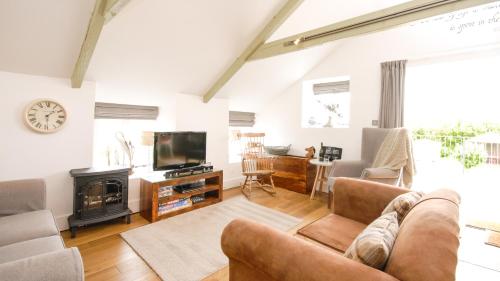 Saddle and Stable Roomsにあるテレビまたはエンターテインメントセンター