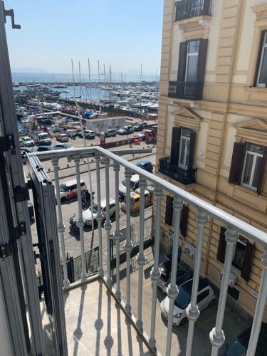 a balcony of a building with a view of a city at Hotel Ausonia in Naples